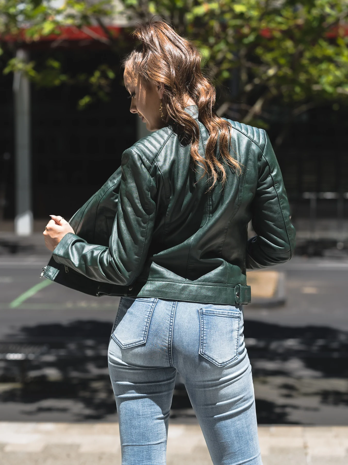 Back side looks of dark green leather jacket womens