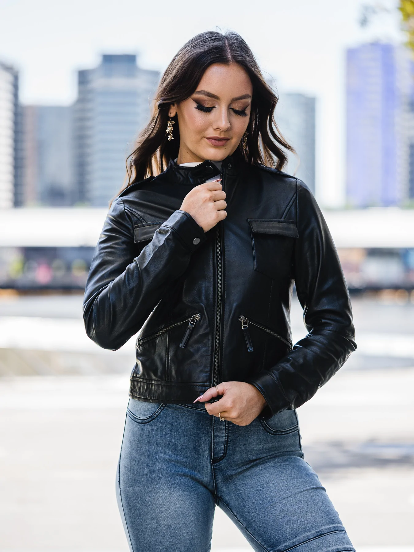 woman zipping up the Black Leather Jacket Womens Outfit